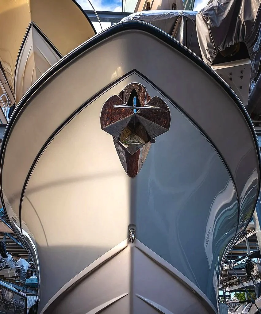 Close-up of Boat Bow and Anchor. This image has a mechanical and artistic quality, connecting engineering, craftsmanship, and visual design. It is a strong fit for modern industrial wall art, abstract photography prints, marina-themed decor, or digit