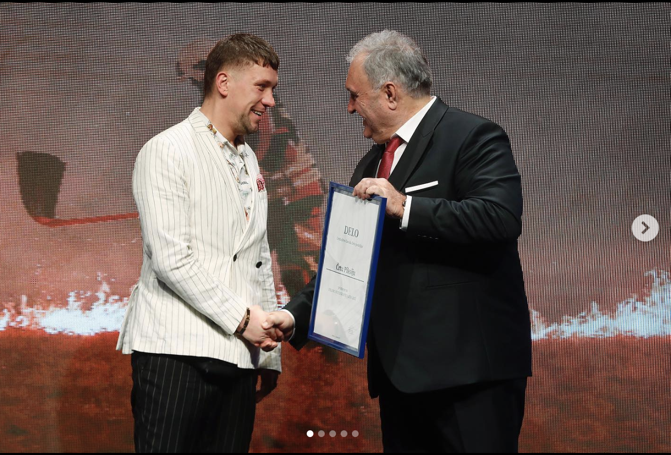 Črt Piksi receiving the Delo Photo of the Year award — a milestone in his documentary and photojournalistic photography work.