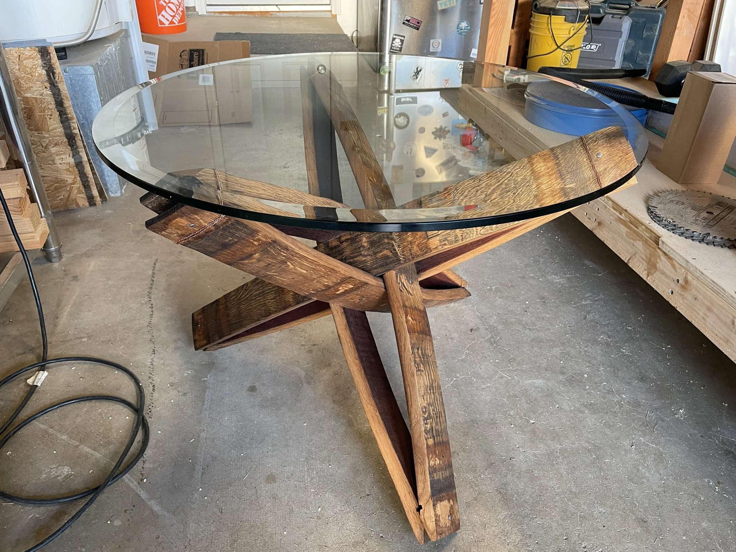 Coffee table made of wine barrel staves with glass top