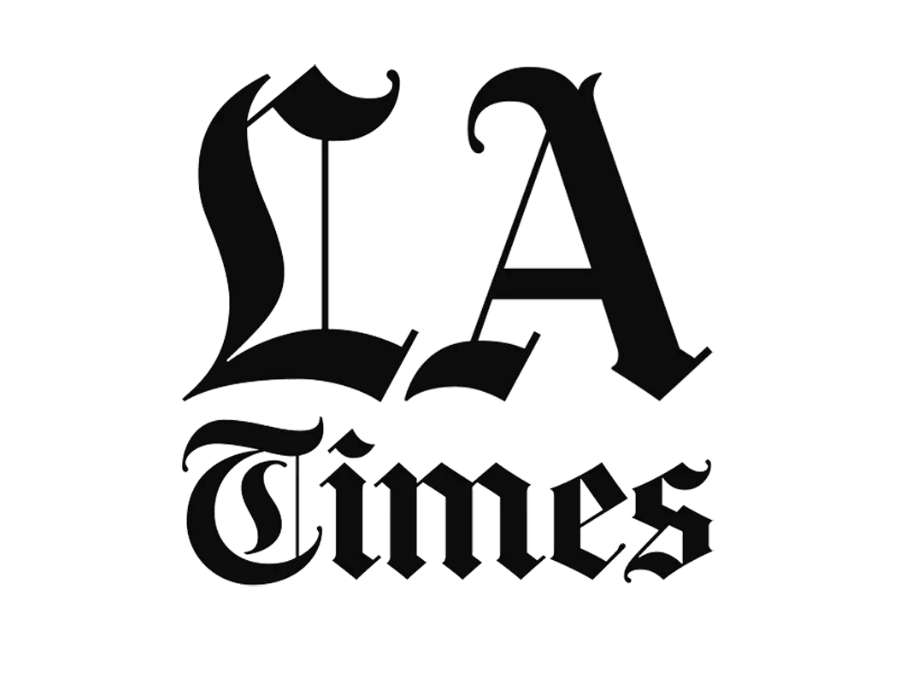 Black and white logo of 'LA Times' with stylized, gothic font.