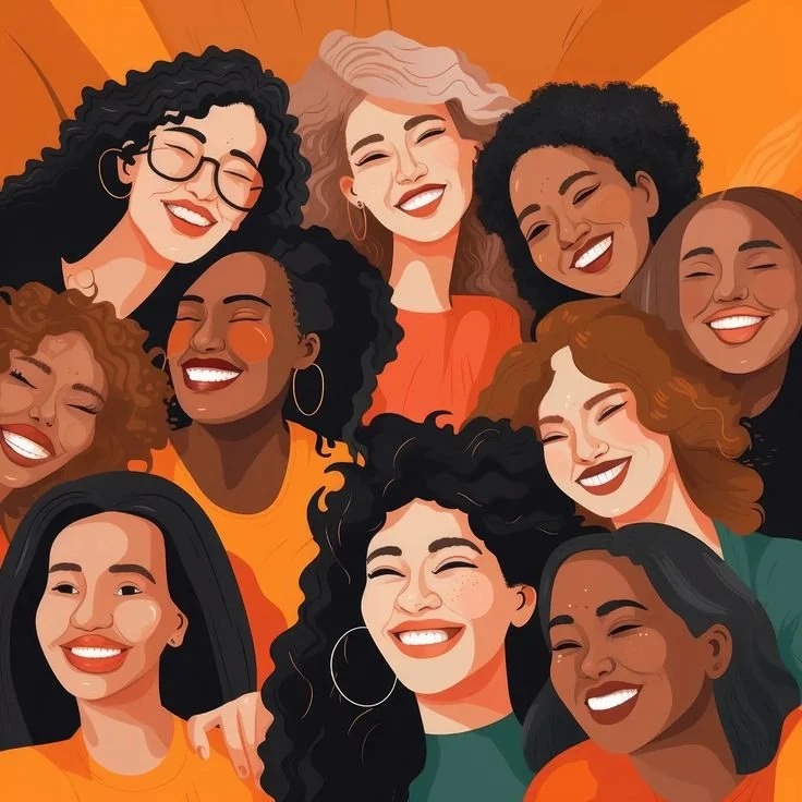 A diverse group of smiling women taking a group selfie. They are of different ethnicities and appearances, dressed in colorful clothing, with joyful expressions and close together.