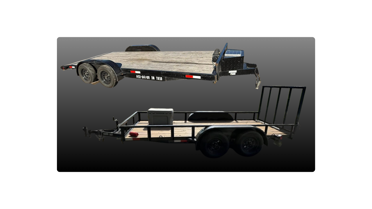 Two flatbed trailers, one black and one tan, used for transporting goods, with black tires and metal frames.