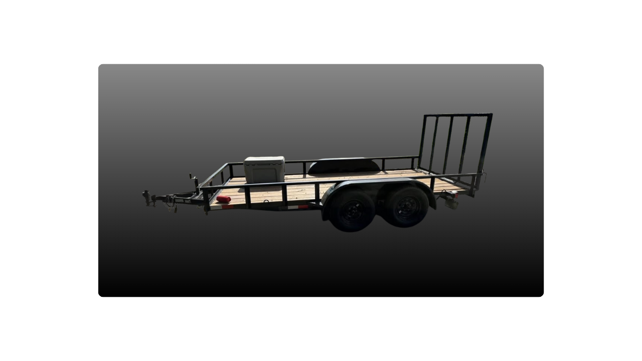 A black utility trailer with a wooden floor, two wheels, and a metal frame, set against a black background.