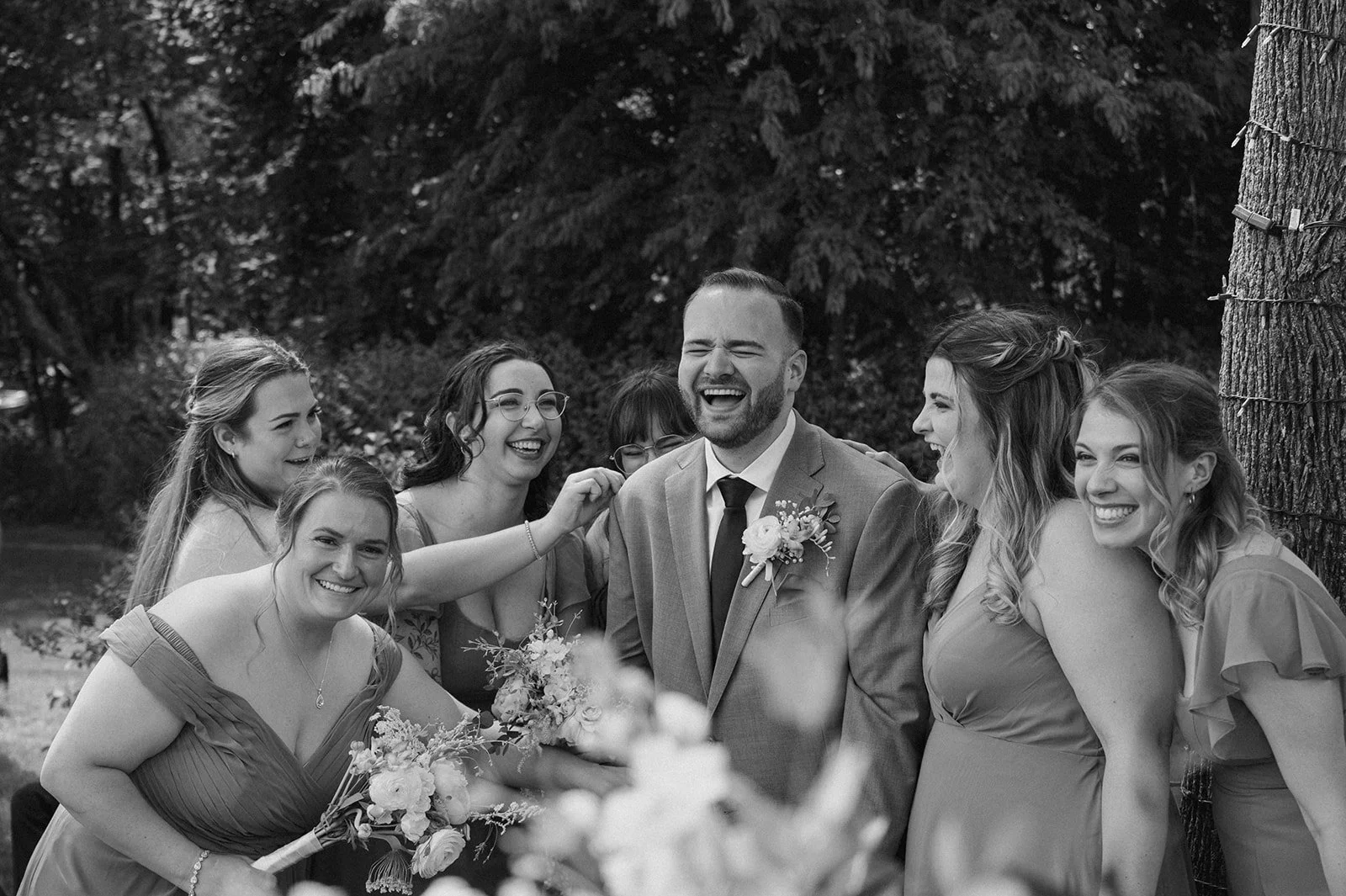 Groom laughing with bridal party.JPG