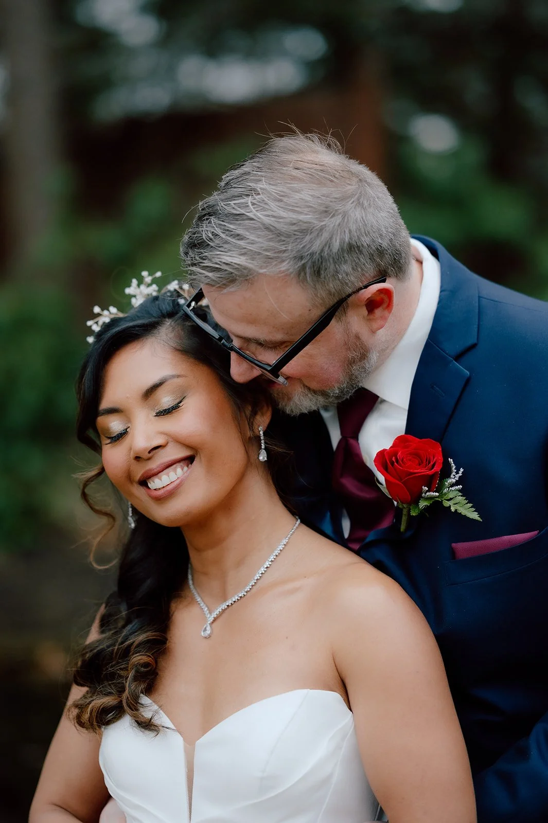 Romantic Candid of Couple smiling during their Couple Portraits at Birchwood Vineyards Wedding Venue in Derry NH