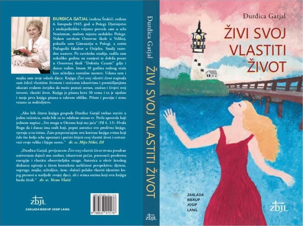 Book (Živi svoj vlastiti život) with artwork featuring a woman in a red dress with blonde hair, standing by a body of water with a bridge, lighthouse, and colorful sky in the background.