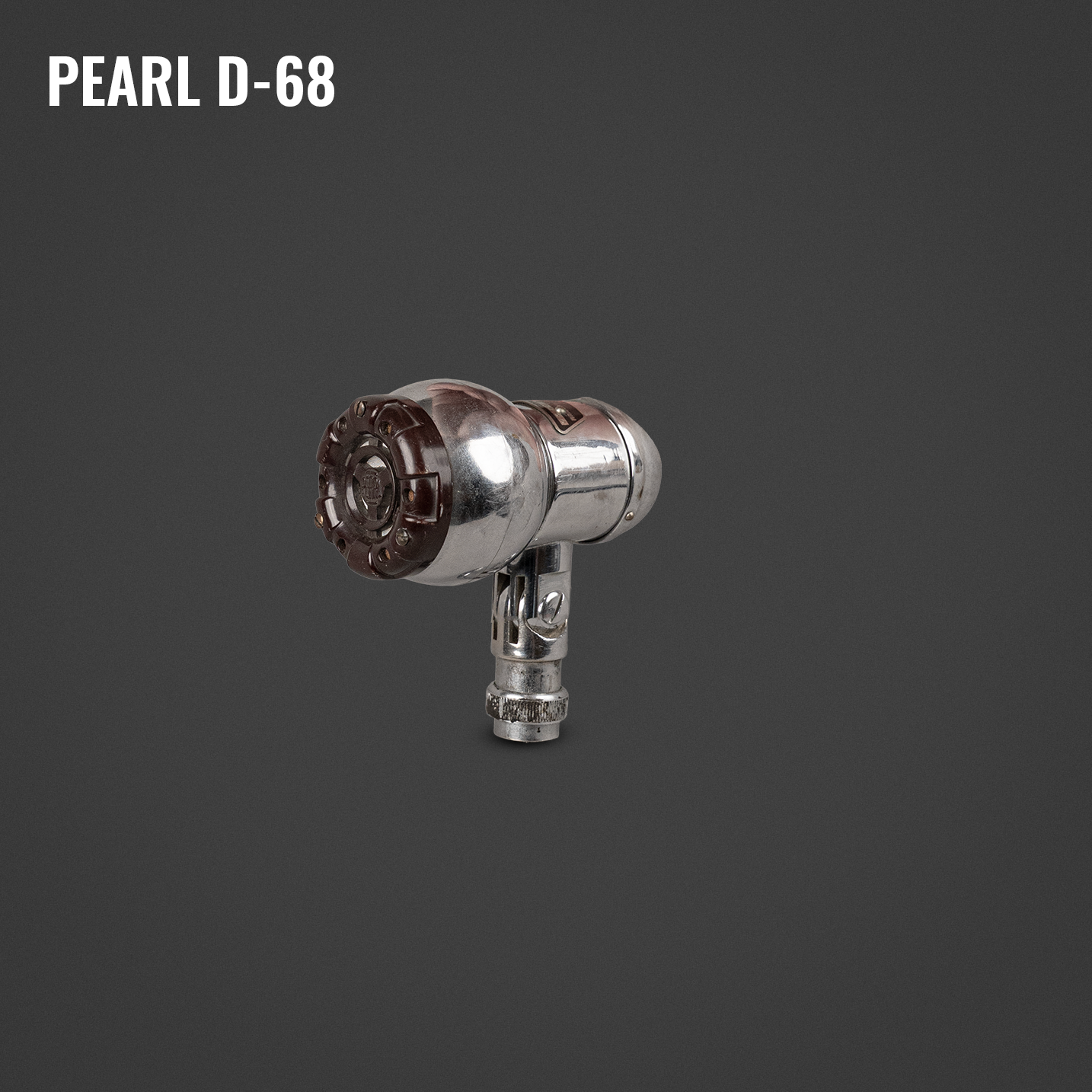 Vintage metal blowtorch with a cylindrical metal tank and a brown and transparent handle, isolated on a dark gray background.