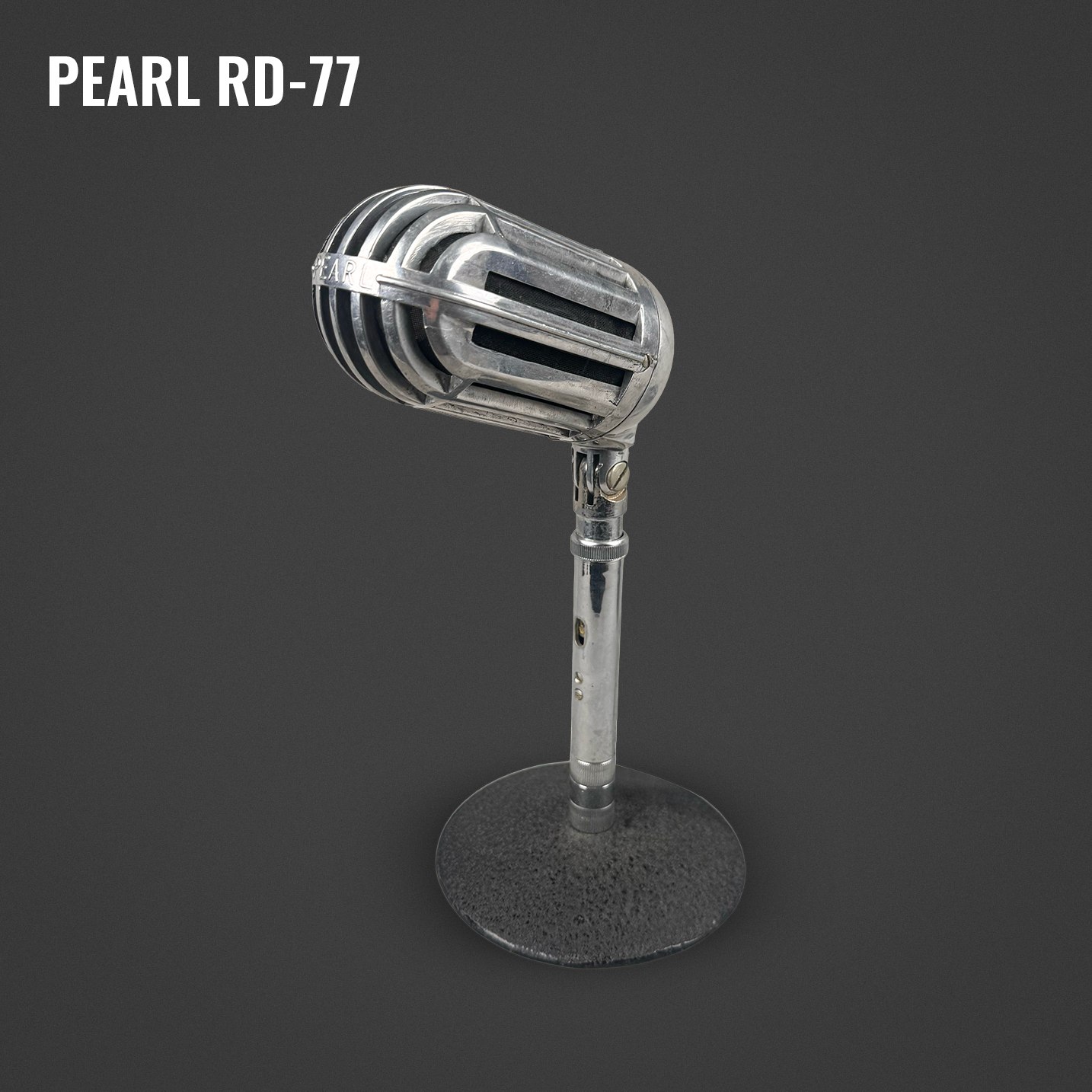 Vintage silver microphone on a stand with a dark background.
