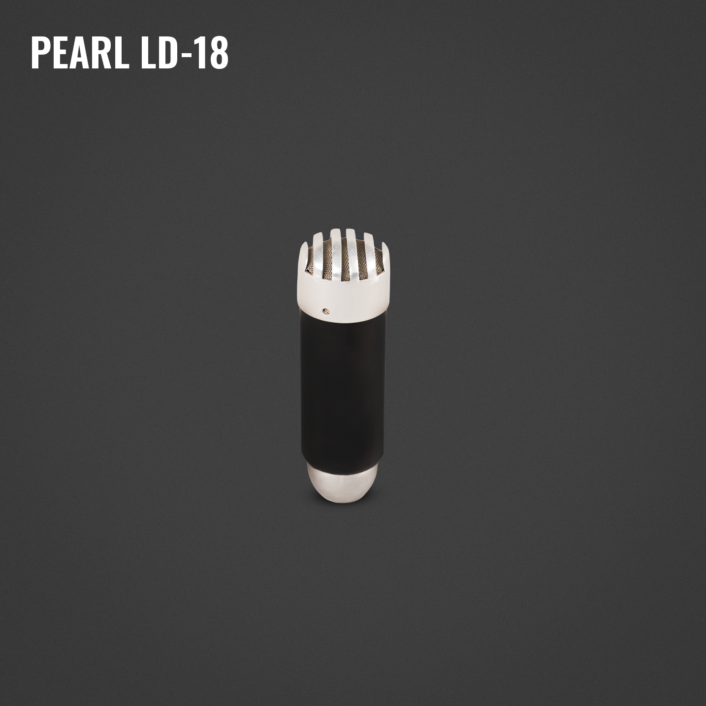 A black and white electric shaver with a cylindrical body and a metallic top with ventilation slits, placed on a dark gray background.