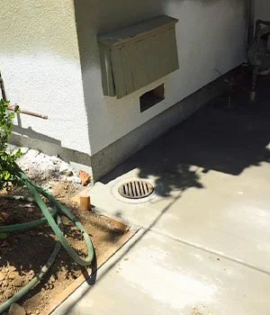 Cement sidewalk with drain installed at San Jose-area house