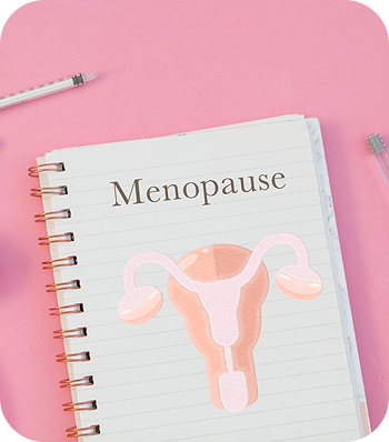 Notebook page with the word 'Menopause' and a diagram of a female reproductive system