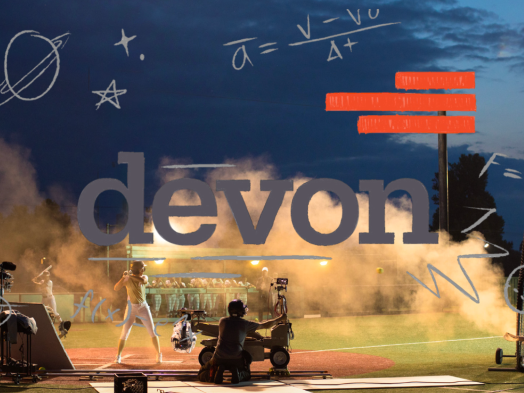 A baseball game is being filmed at a field during dusk. Cameramen with equipment are recording the players and audience, with a smoky or foggy atmosphere and handwritten scientific doodles overlaid in the sky.