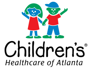 Two children, a girl and a boy, holding hands and smiling, with the text 'Kids First' below.