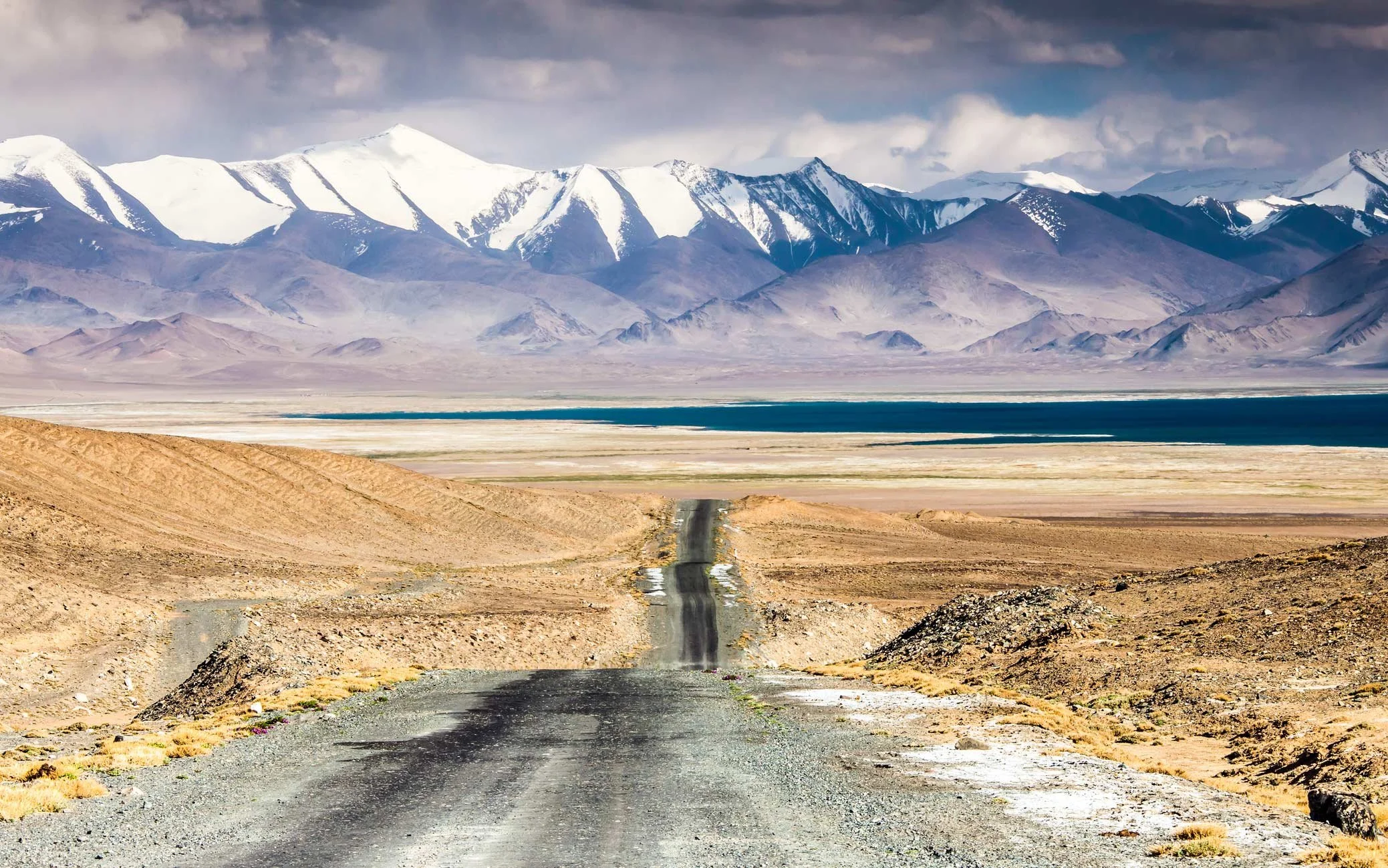 Long mountain road through the Pamir Mountains in Tajikistan during the Great Silk Run