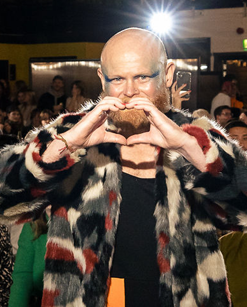 Danny Bent on stage engaging an audience during a live event