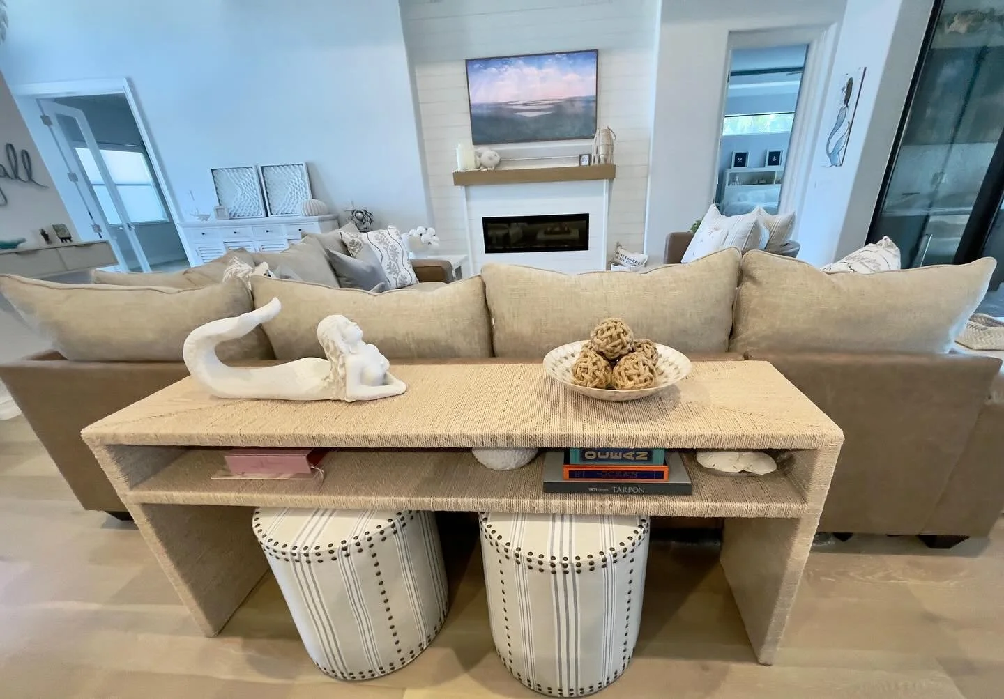 Setting the stage for a relaxed coastal vibe 🤍

A woven console layered with playful drum ottomans &mdash; natural texture, easy function, and that effortless, collected feel I love.

Ready to bring coastal warmth into your space?

#staugustinedesig
