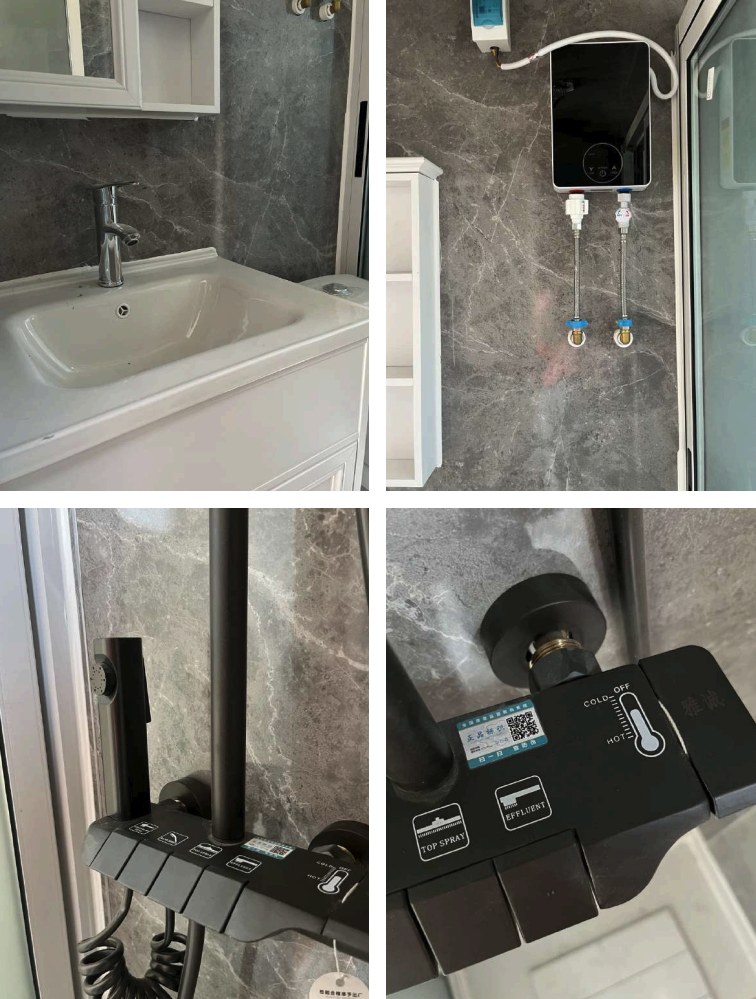 A bathroom with a white sink and gray marble walls, a water heater with pipes, a handheld shower head with controls, and a black radiator heater.
