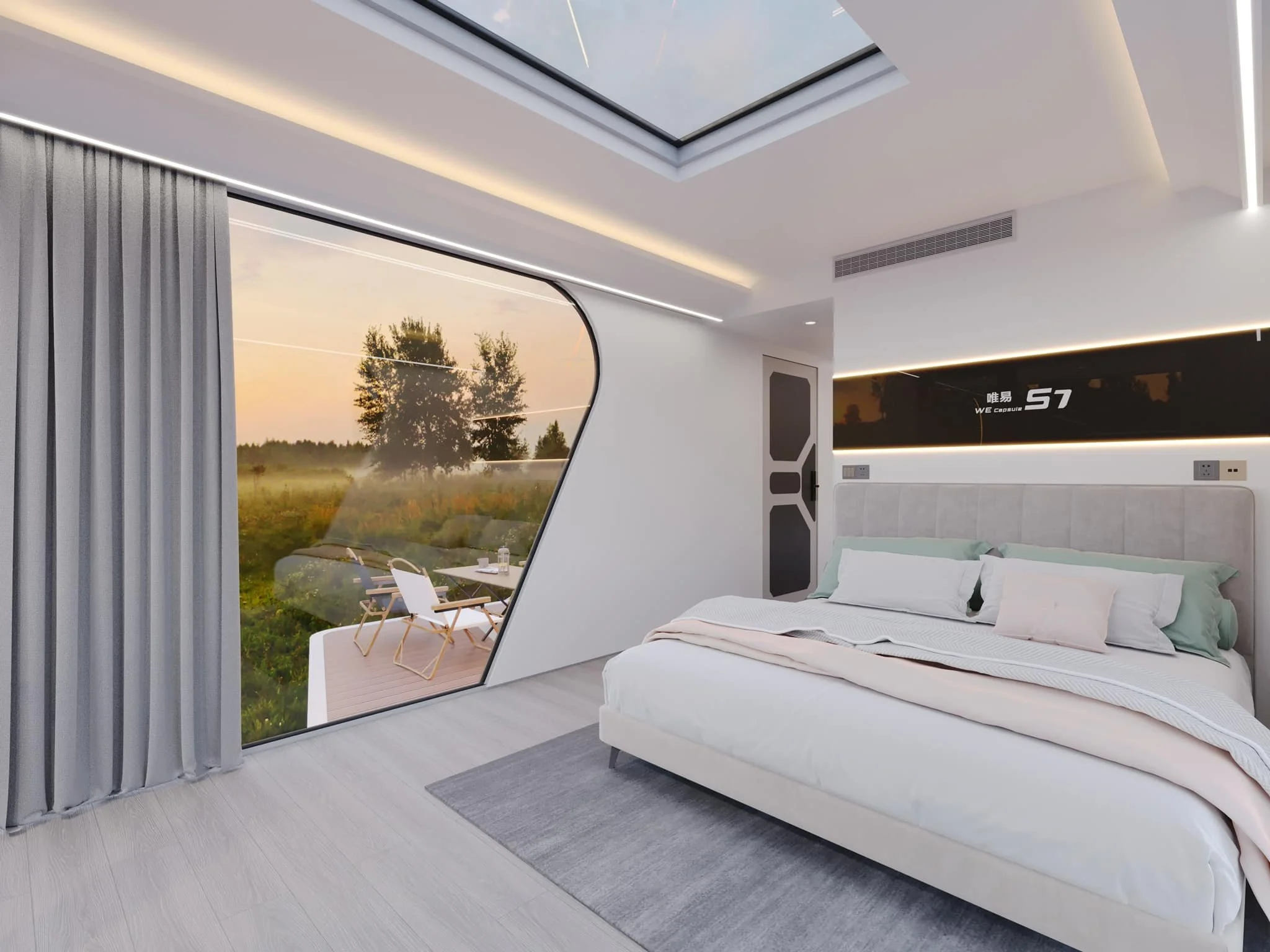 Modern bedroom with a large glass window showing an outdoor patio with chairs and green field at sunset, minimalist decor, white walls, and a bed with white bedding.