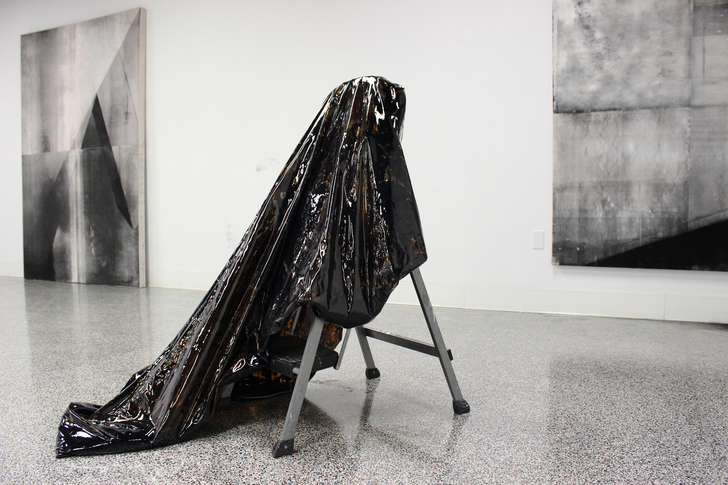  Liquid tar encapsulated in vinyl, moveable gallery wall, step ladder 