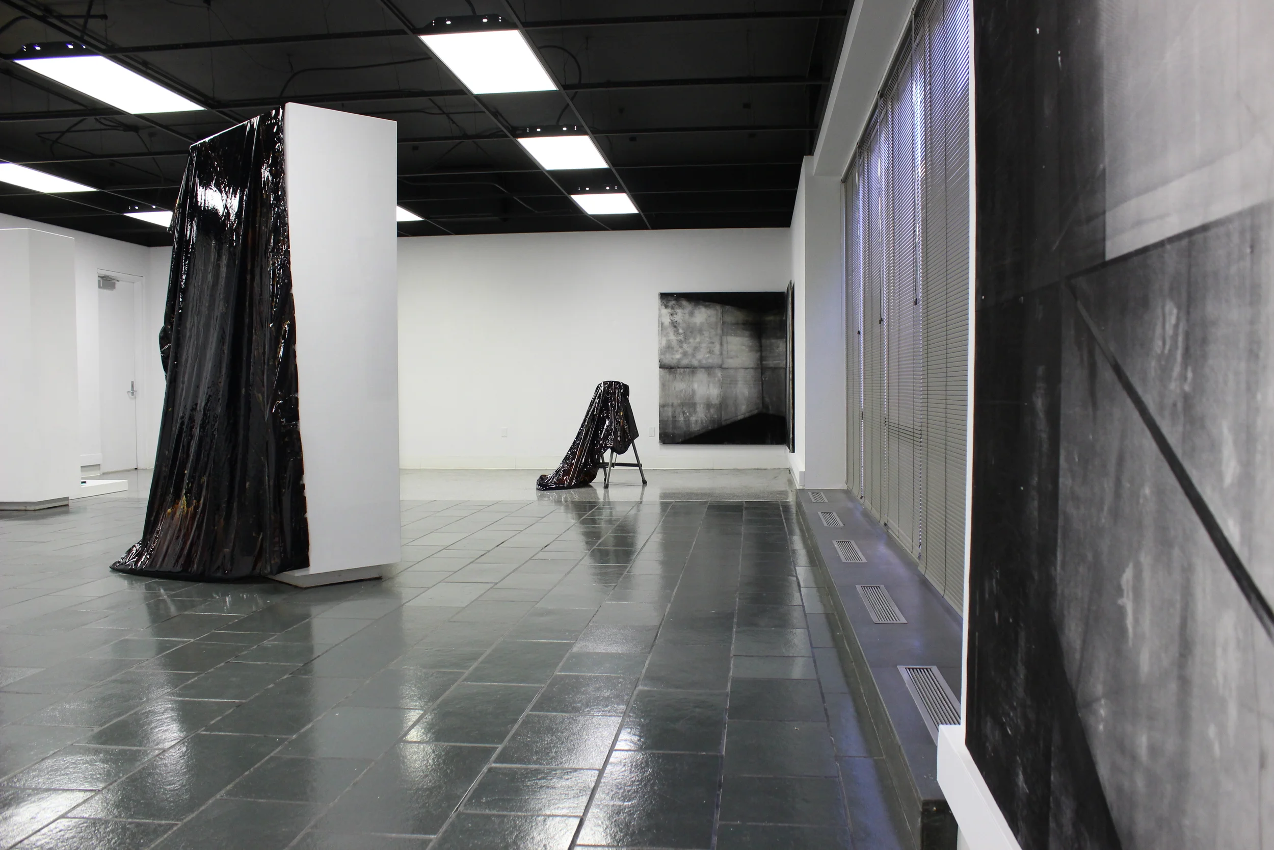  Liquid tar encapsulated in vinyl, moveable gallery wall, step ladder 