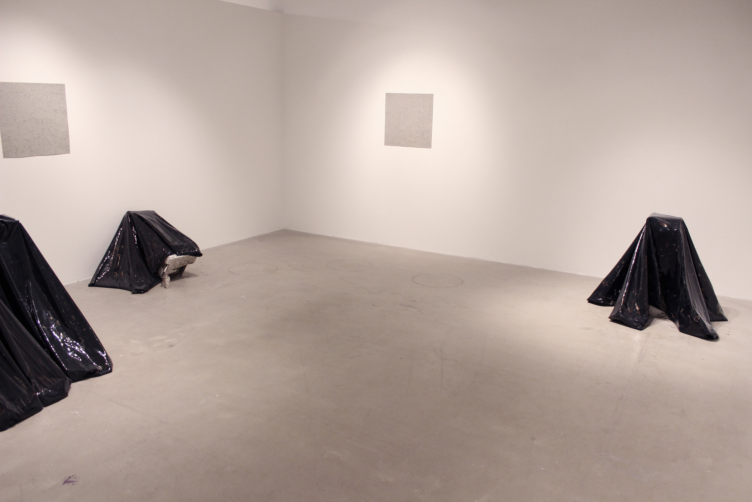  Liquid tar encapsulated in vinyl with found architectural objects 