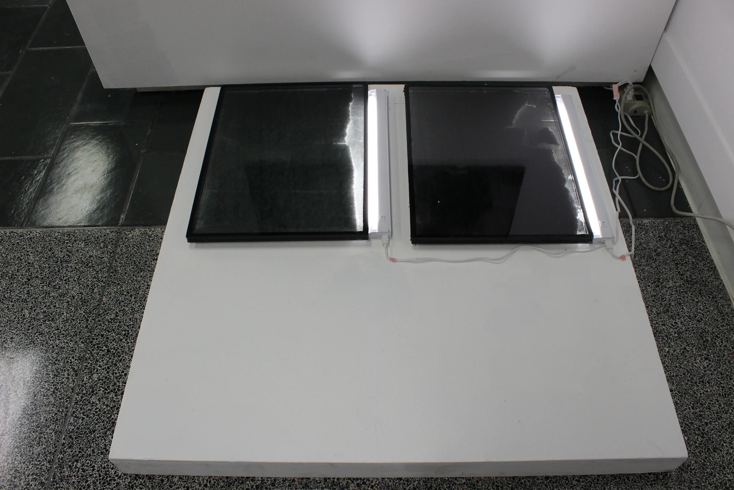  Acrylic ink, duo paned tinted windows, styrofoam, tube lights 