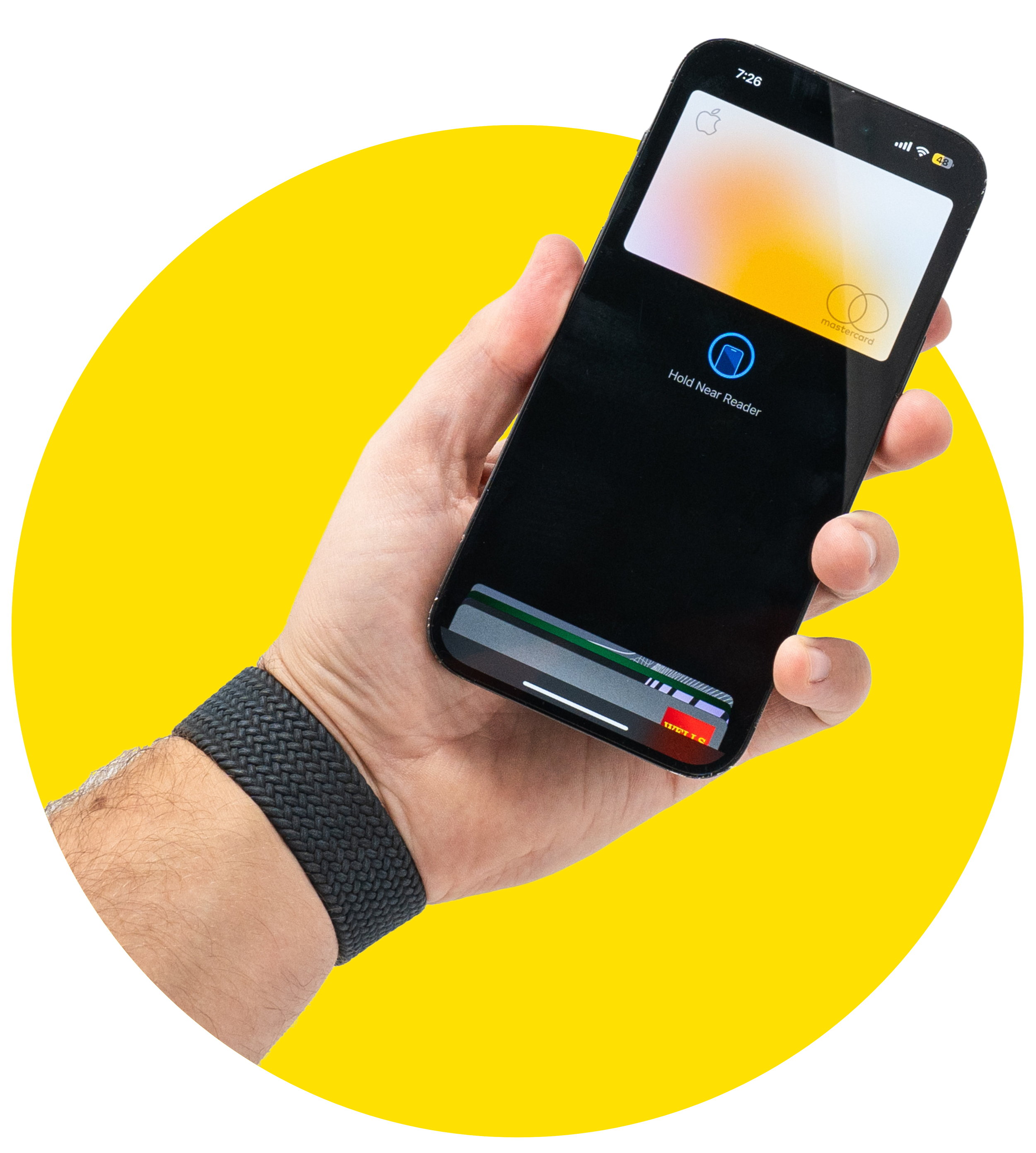 Person holding a smartphone with a contactless payment process on screen, showing a message to hold near reader and a digital wallet with a credit card at the top, against a yellow circular background.