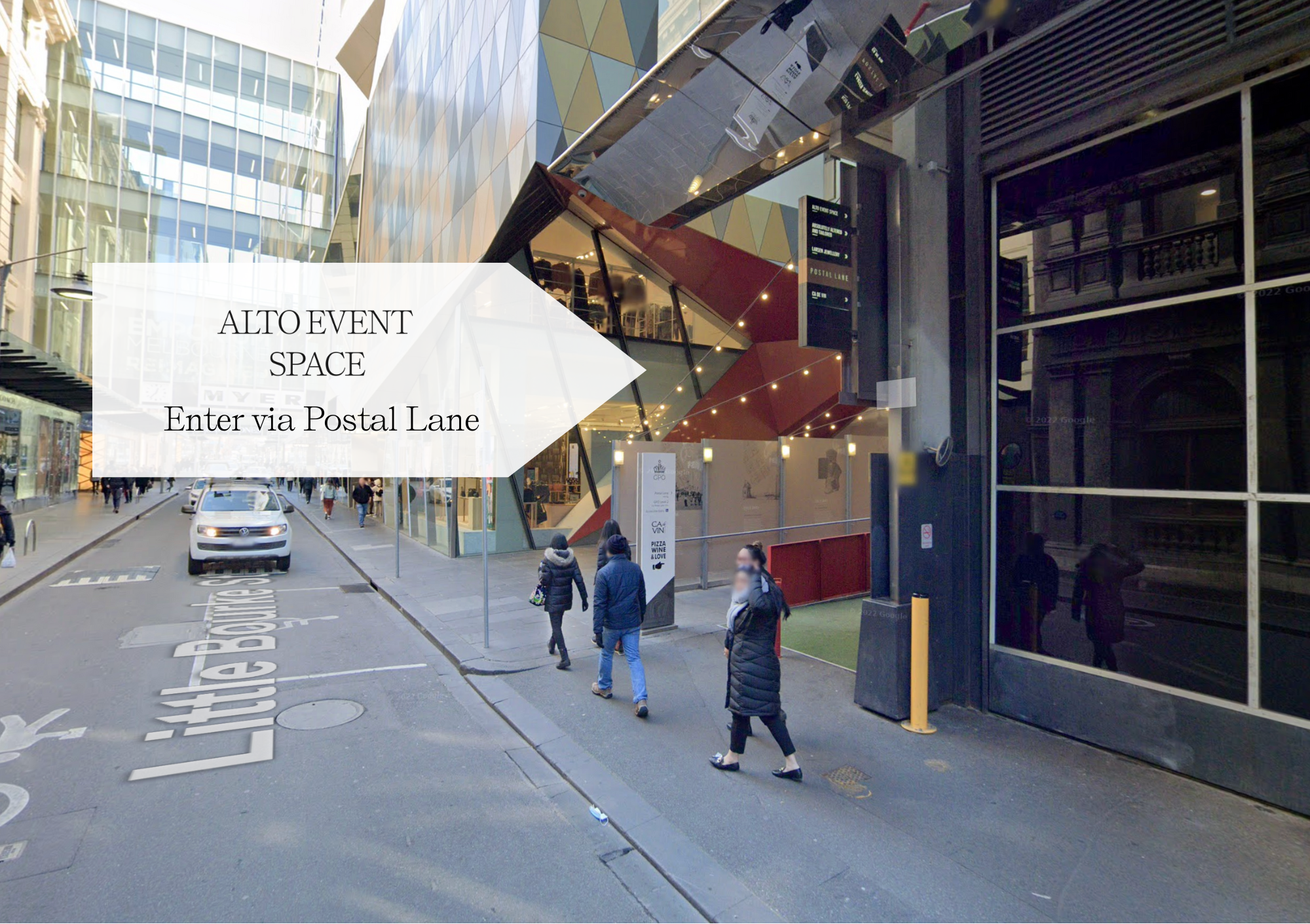 Pedestrians walking past a modern building with an entrance labeled 'ALTO EVENT SPACE' via Postal Lane on a city street.