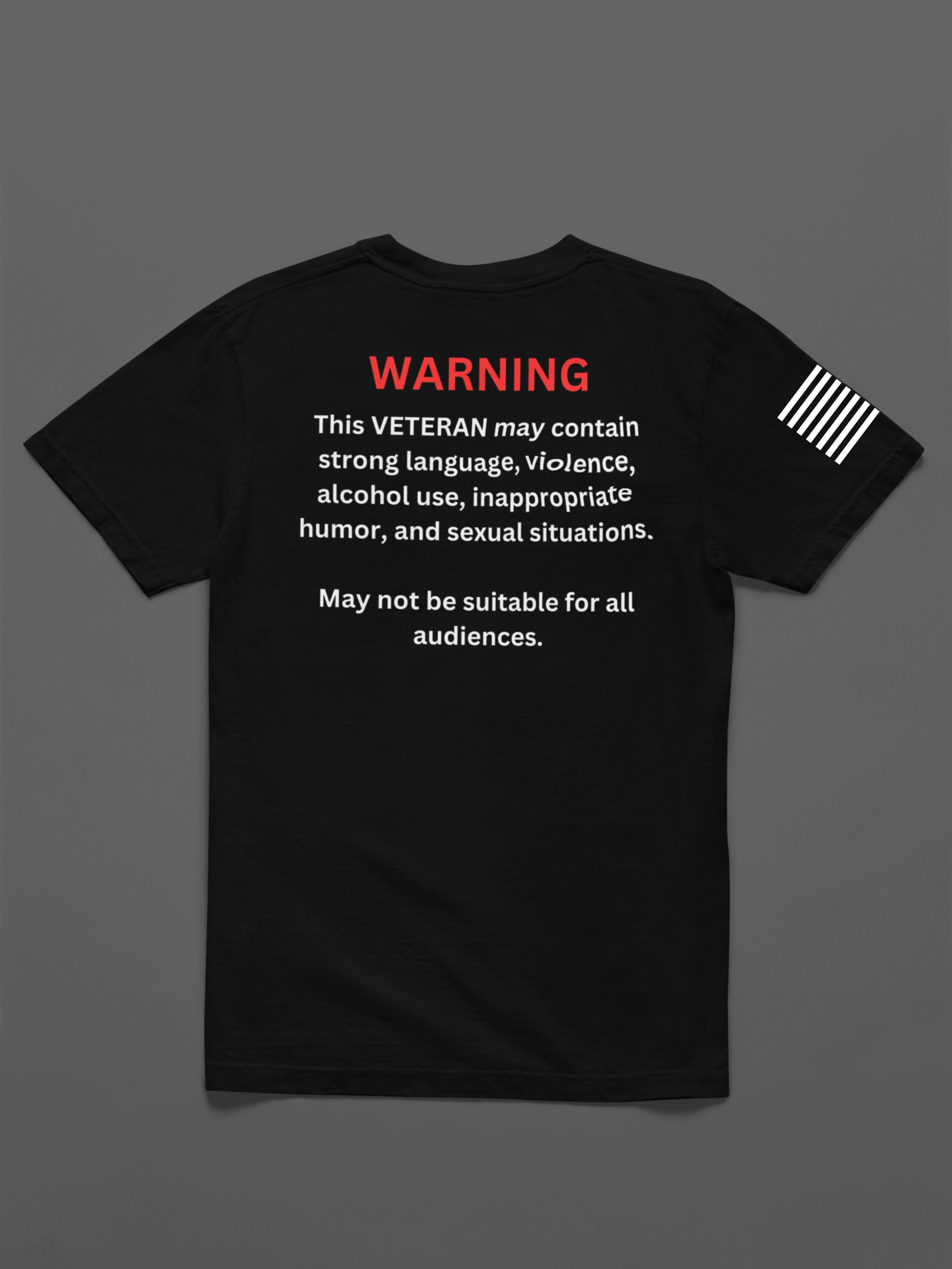 Black T-shirt with a warning label on the back, red warning text at the top, and a white striped badge on the sleeve.