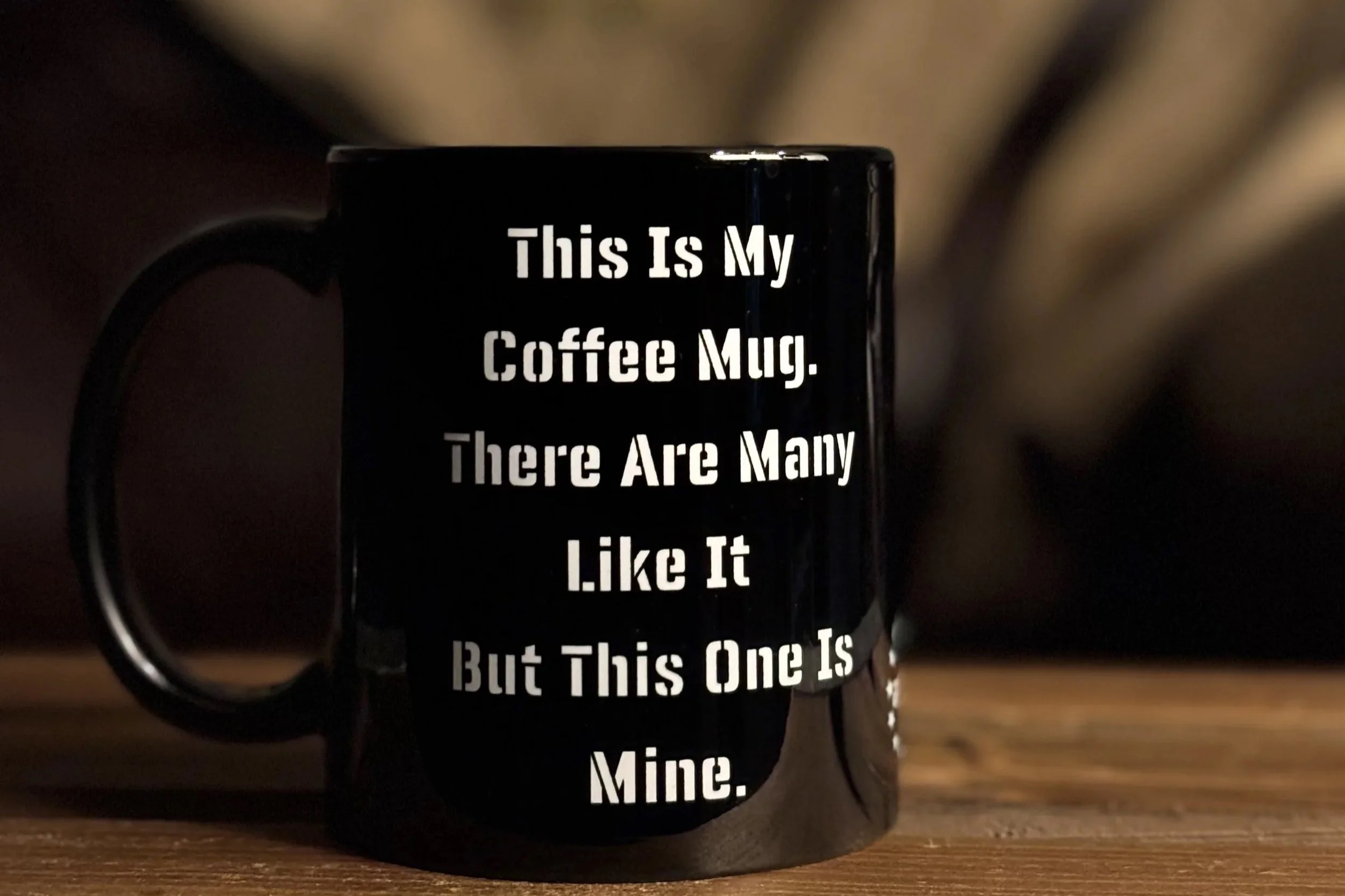 Black coffee mug with white text that reads: 'This Is My Coffee Mug. There Are Many Like It But This One Is Mine.'
