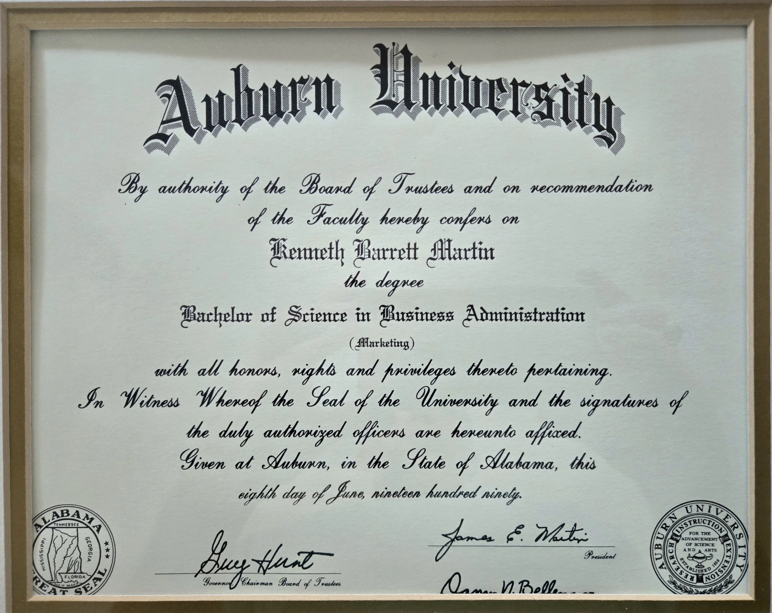 Diploma from Auburn University conferring a Bachelor of Science in Business Administration (Marketing) to Kenneth Barrett Martin, awarded on June 8, 1999, signed by university officials.