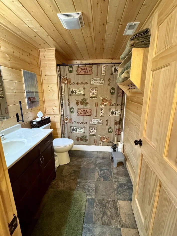 Basement bathroom with tub and shower - access from walkout basement door