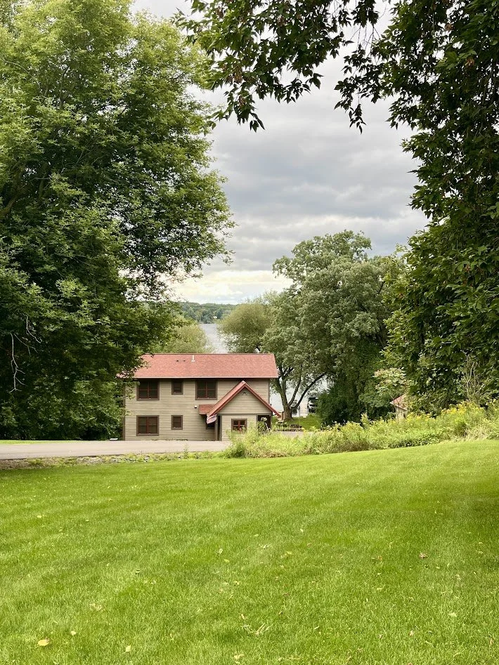 Tree lined road access to highway