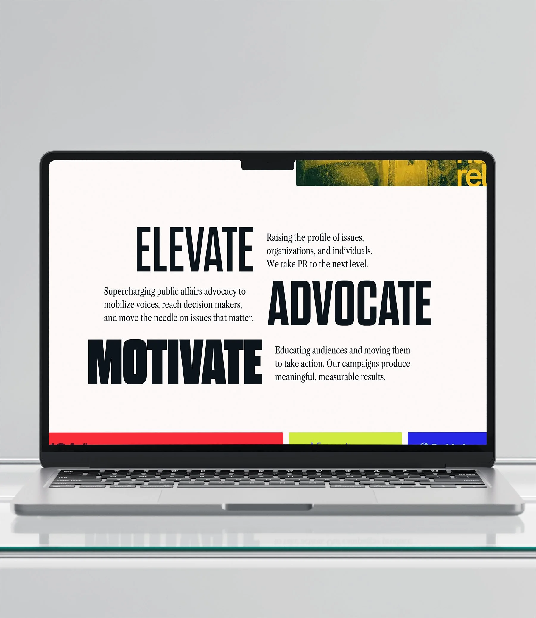 Laptop displaying a website with large bold words 'ELEVATE,' 'ADVOCATE,' 'MOTIVATE,' and supporting text about public affairs advocacy and campaigns.