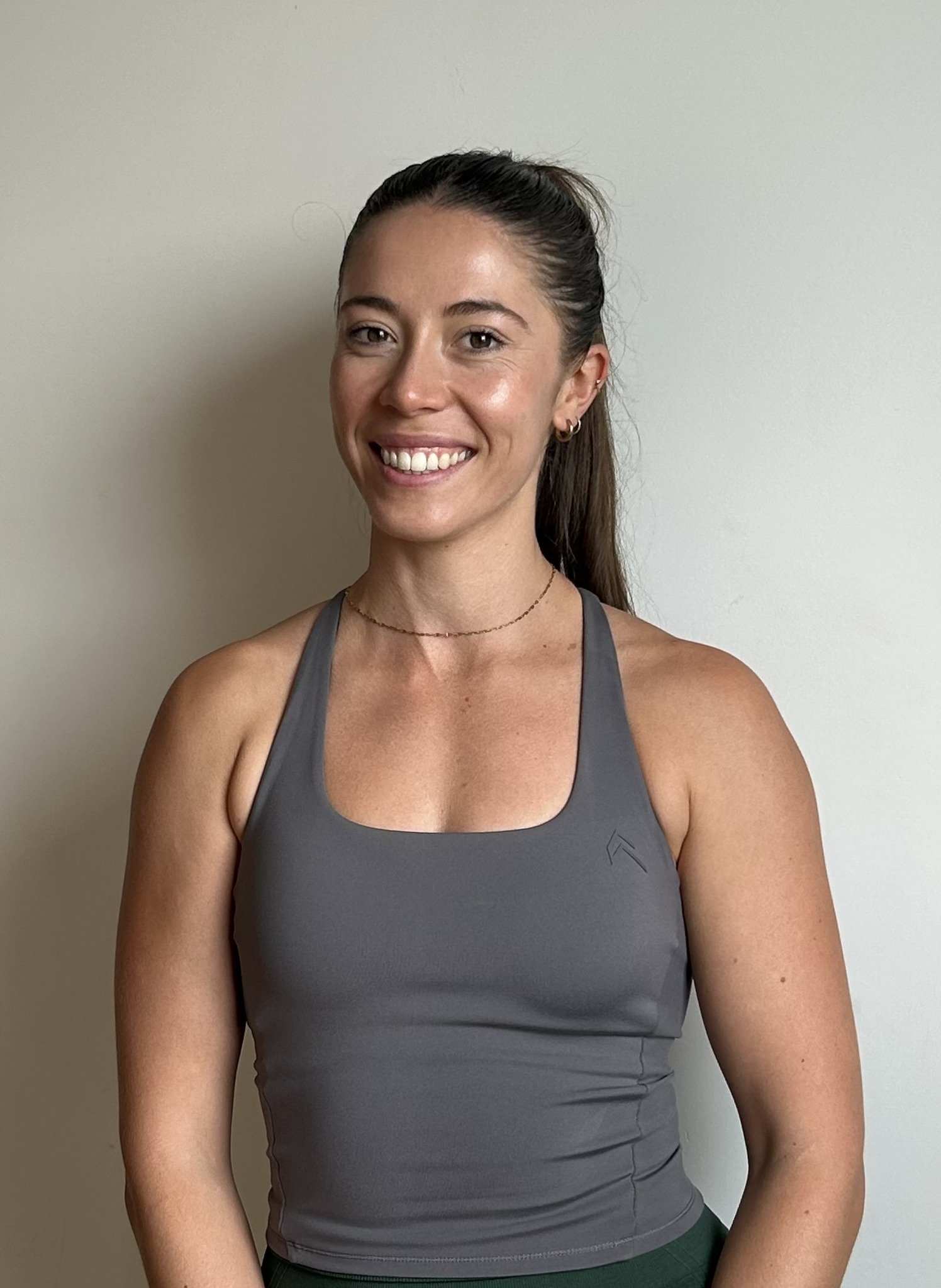 Assistant coach of The Resistance, Lilli, smiling for the camera.