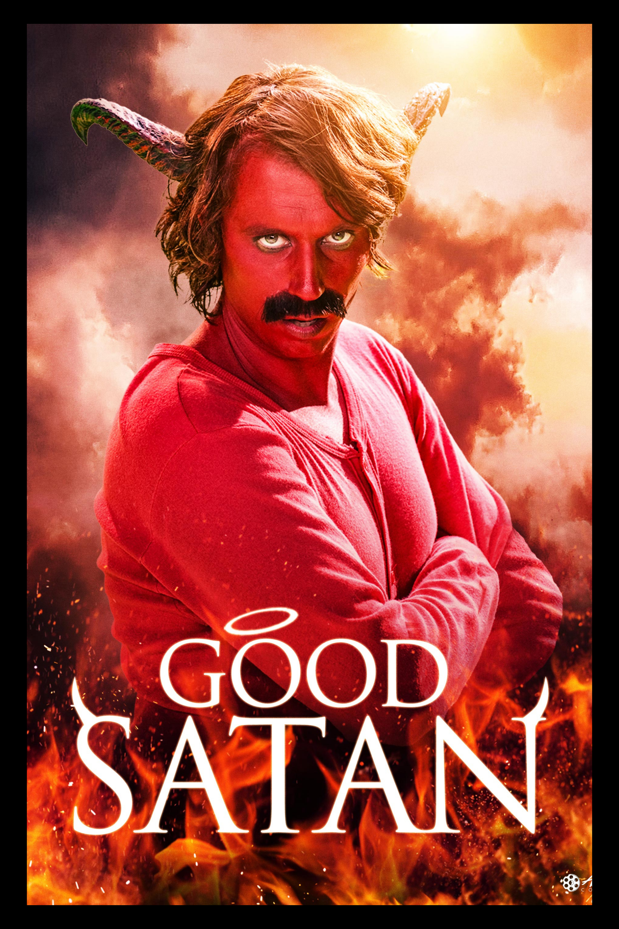A man with a mustache and wavy hair dressed as Satan with horns, red face, wearing a red hoodie, standing in front of flames and smoke with the title 'Good Satan' and a small halo above the 'O'.