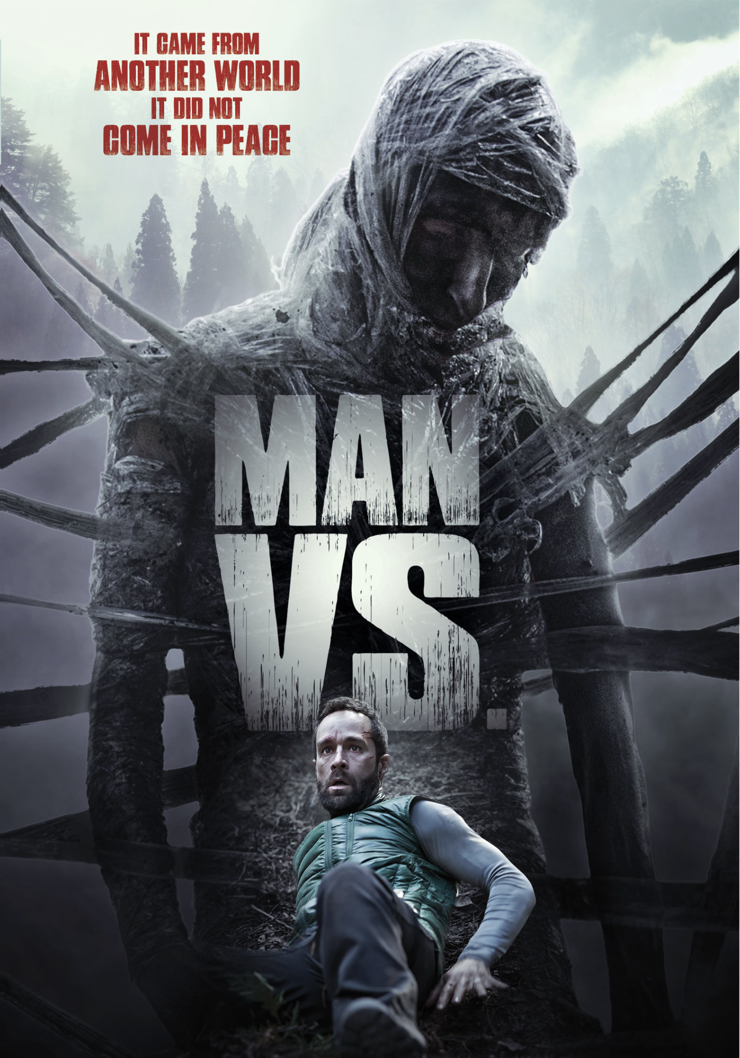 A movie poster for 'Man Vs,' showing a man sitting on the ground in the foreground and a large, monstrous figure with a hooded head and numerous tentacle-like limbs in the background, with a foggy forest behind it. The tagline reads 'It came from another world. It did not come in peace.'