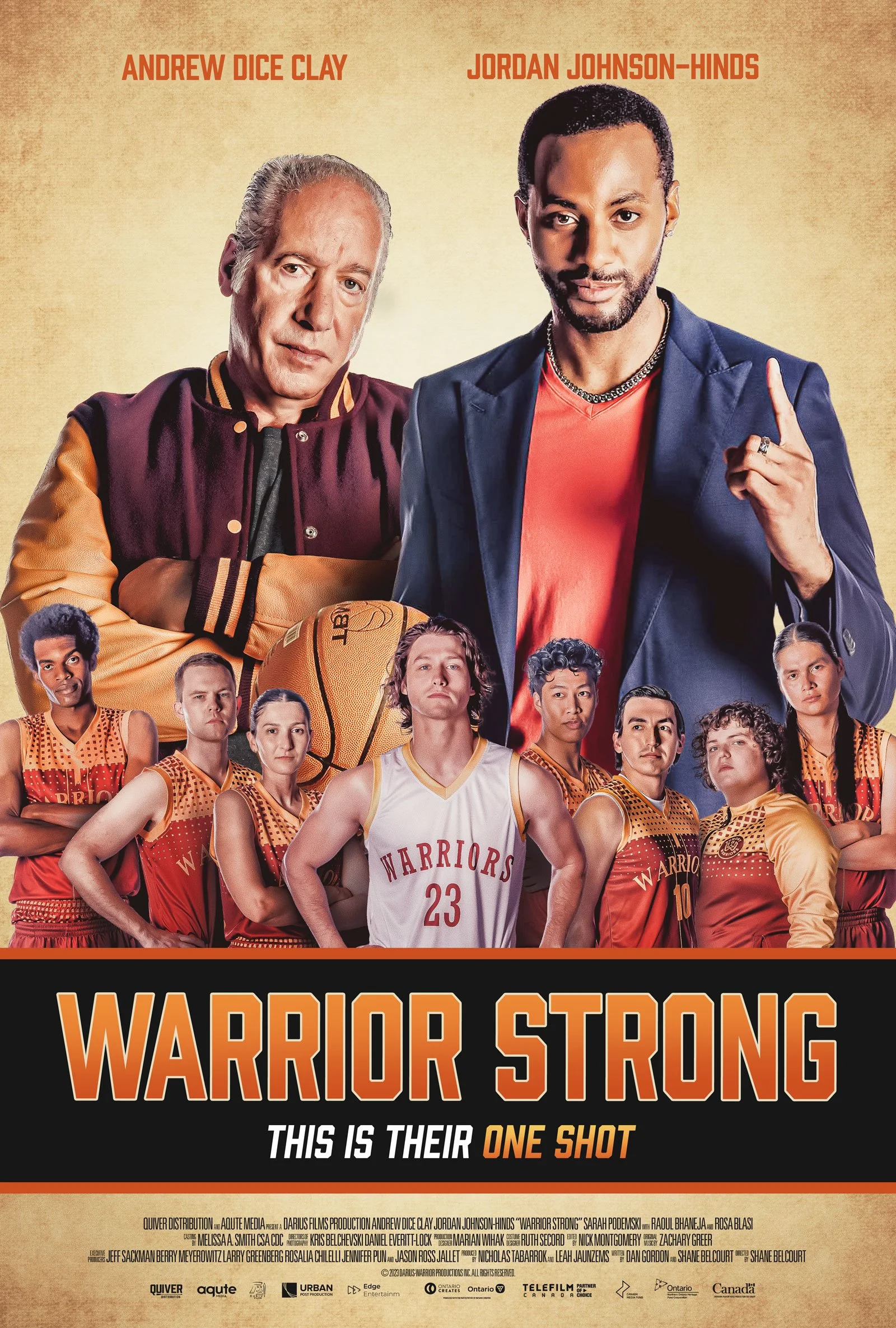 Poster for the movie Warrior Strong featuring Andrew Dice Clay and Jordan Johnson-Hinds, with a basketball team of young players in orange uniforms, and the title in bold orange letters.