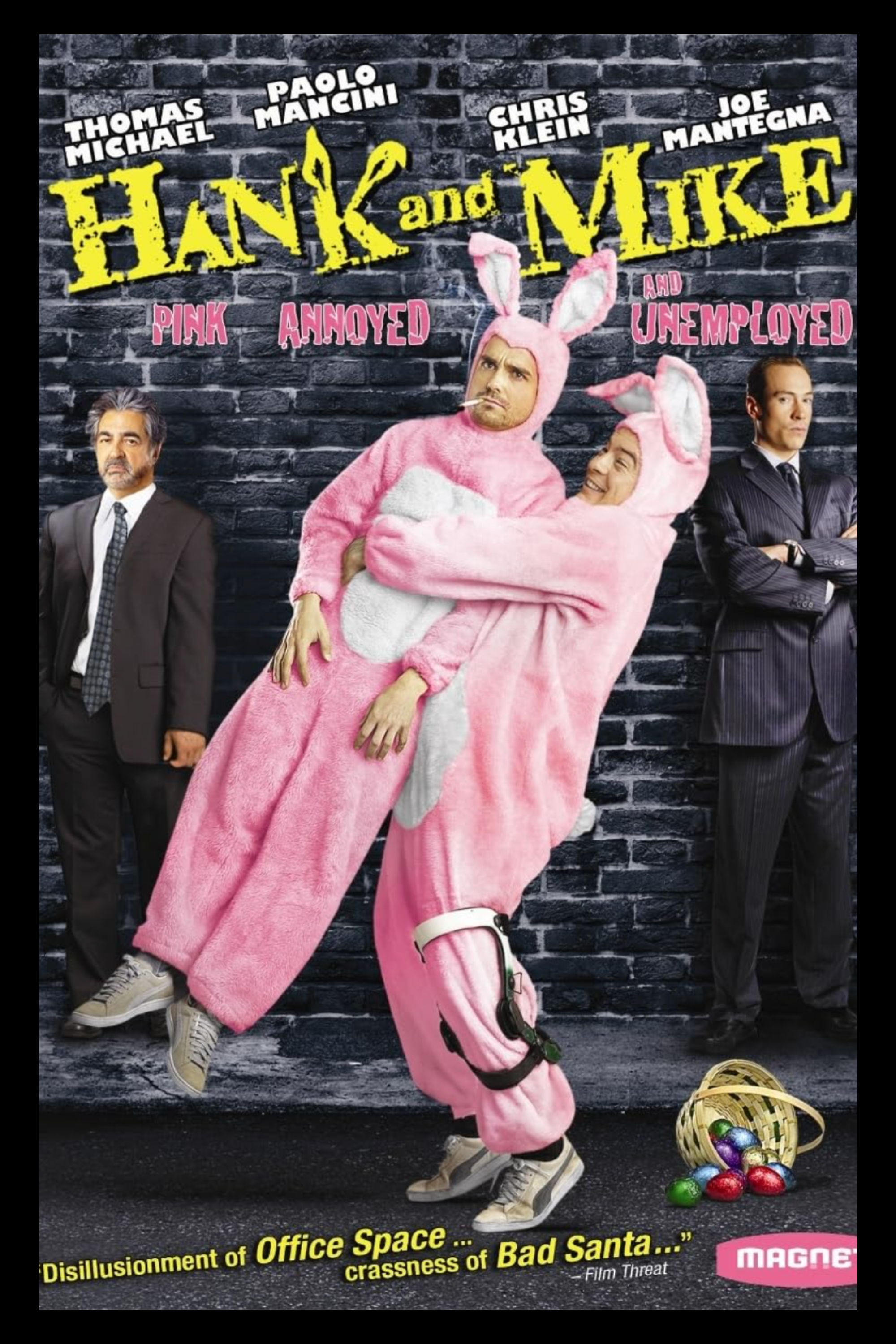 Movie poster for "Hank and Mike" featuring two men in pink bunny costumes hugging, with one man wearing a straight face and the other smiling. Two men in suits stand on either side against a brick wall background, with a basket of colorful Easter eggs at the bottom right.