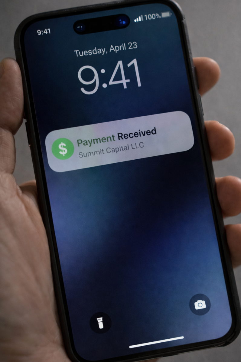 A phone with a notification that a payment has been received.
