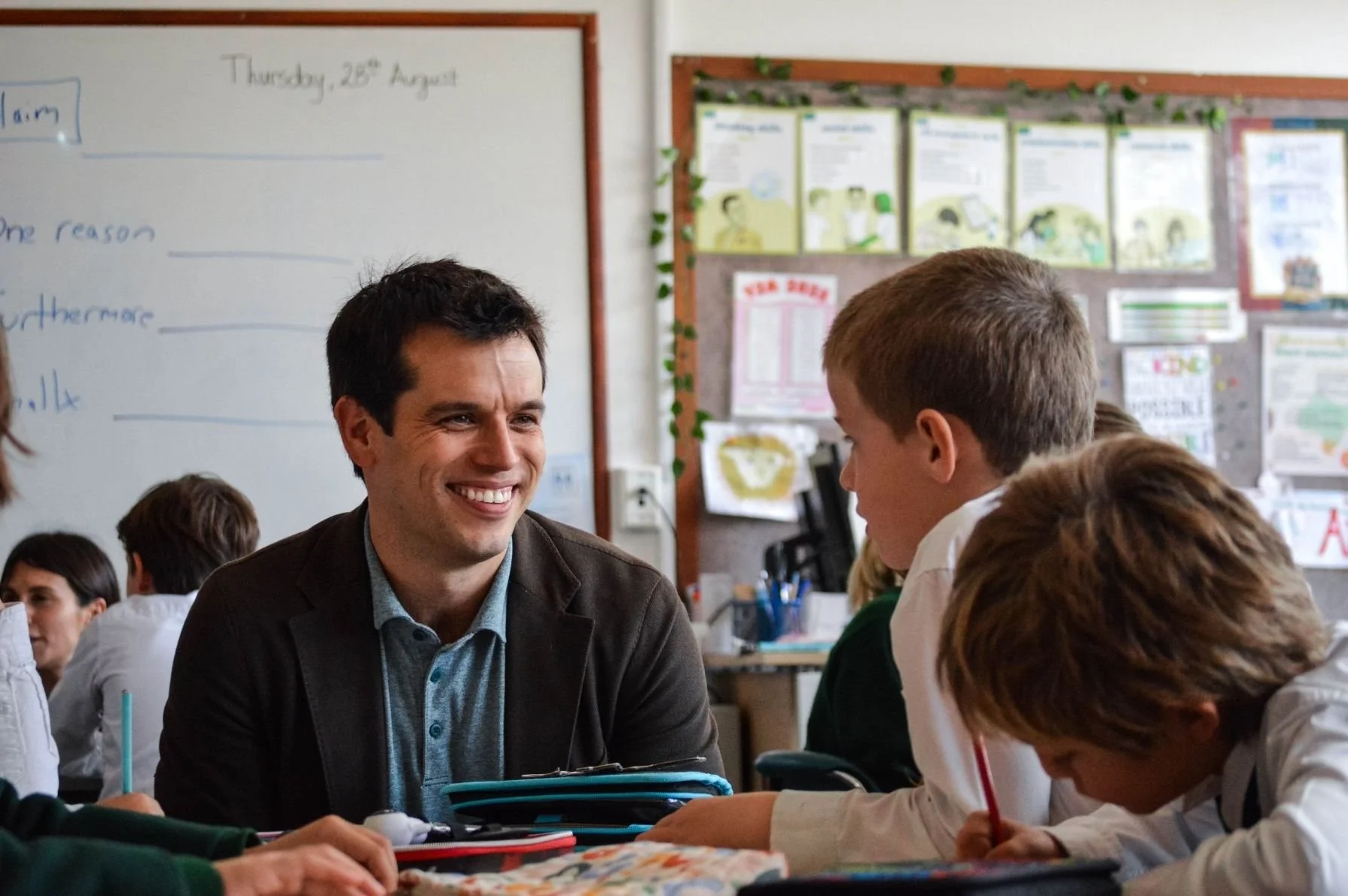 Gerrit Jones-Rooy engaging with young students during a literacy and science lesson.