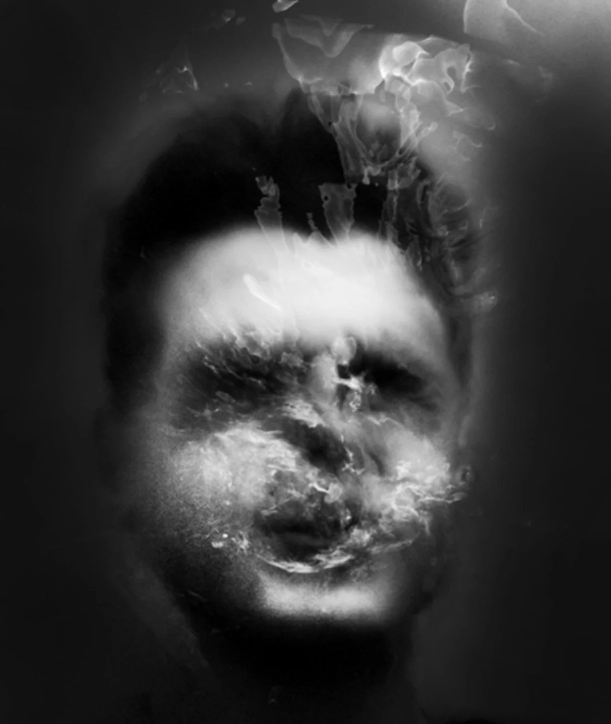 Black and white abstract image of a person's face, partially obscured by swirling smoke or mist.
