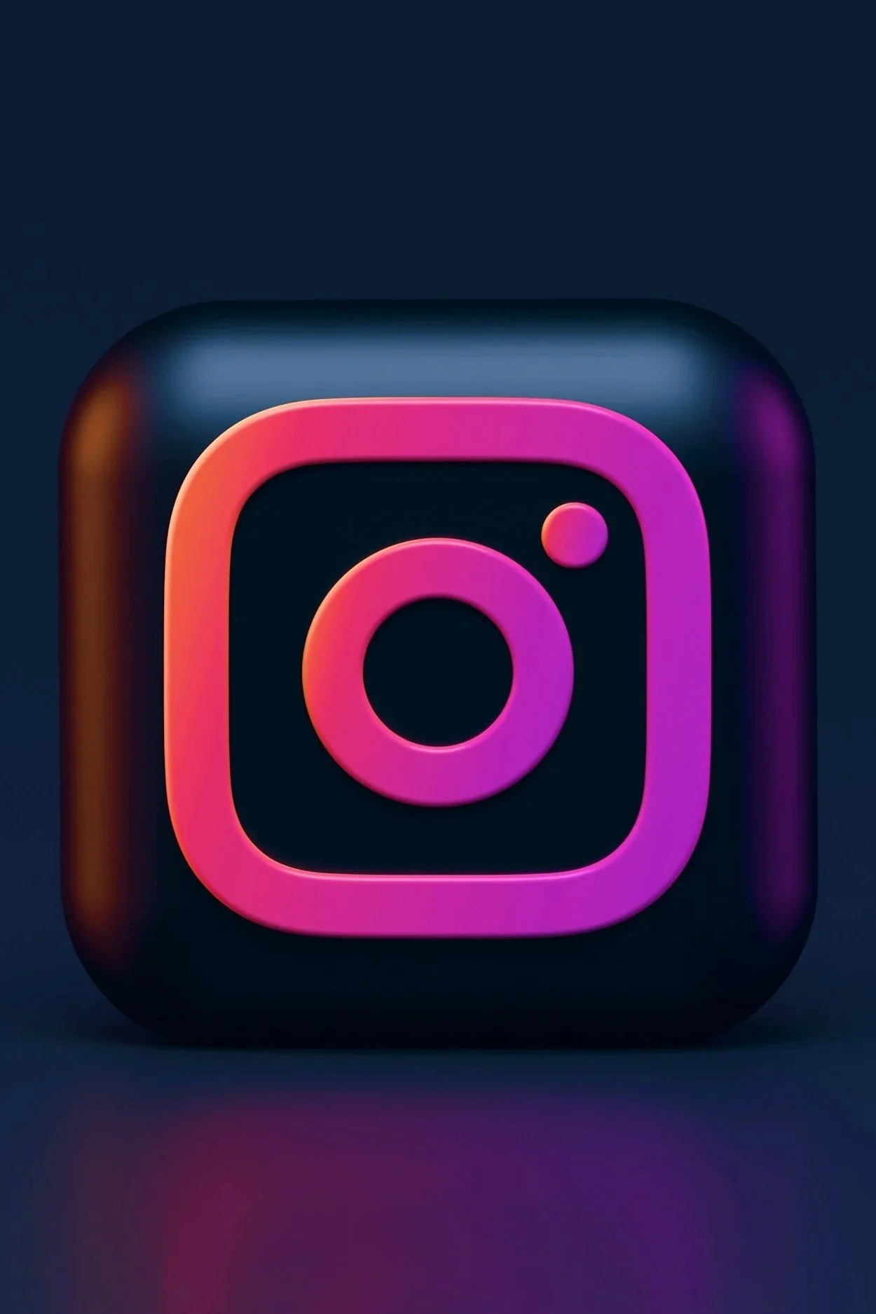 3D rendering of Instagram logo with pink, purple, orange, and blue gradients on a dark background
