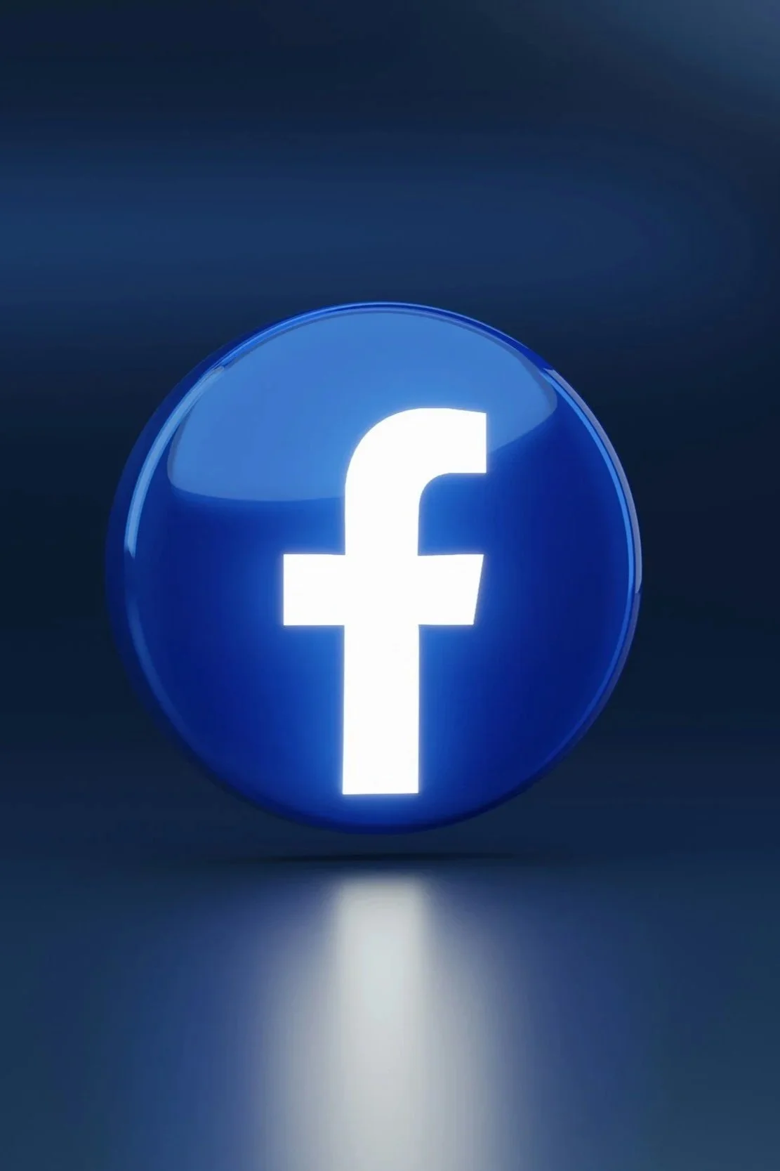 A glowing blue Facebook logo on a dark background.