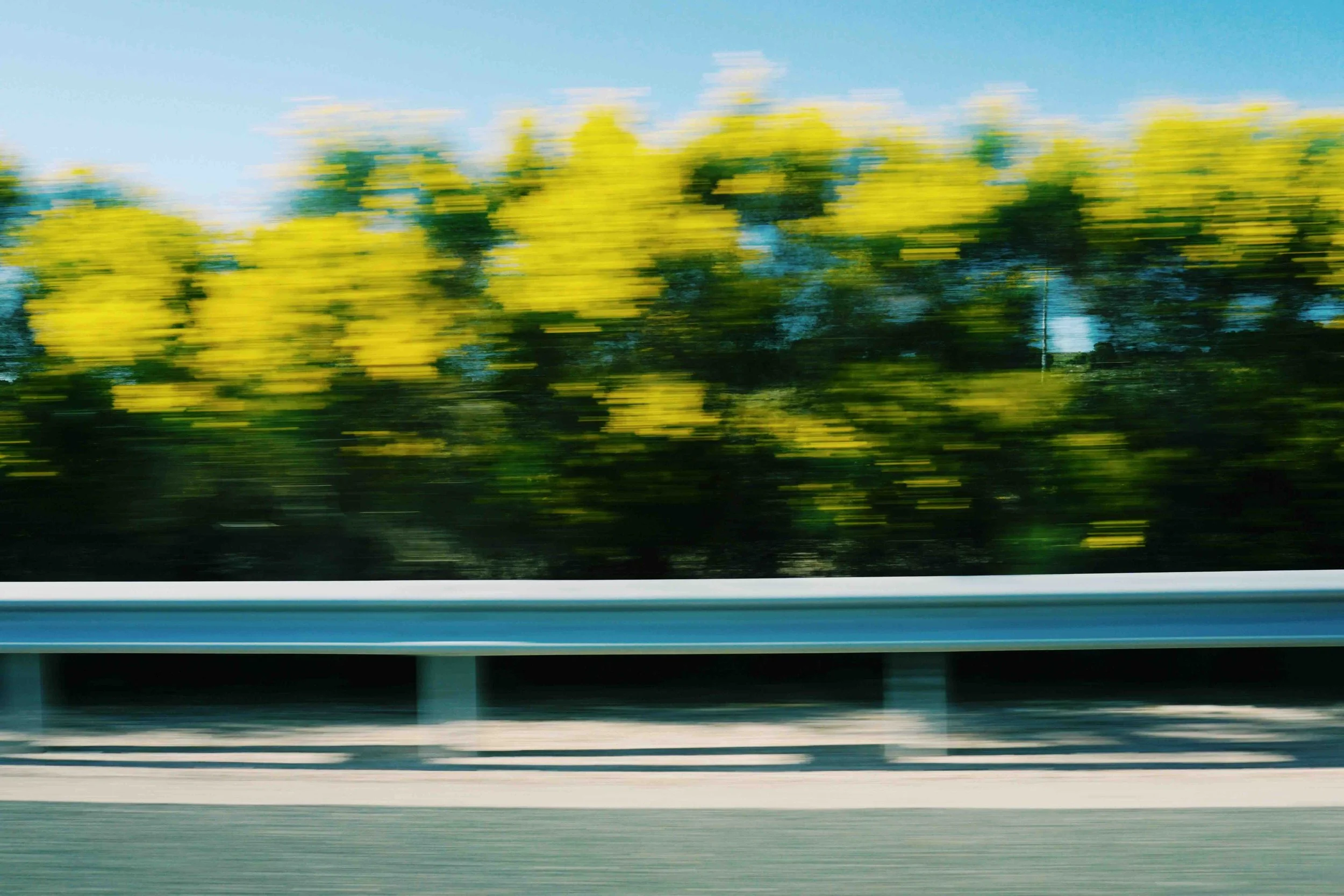 Blurred trees on road_KB Consulting Studio branding