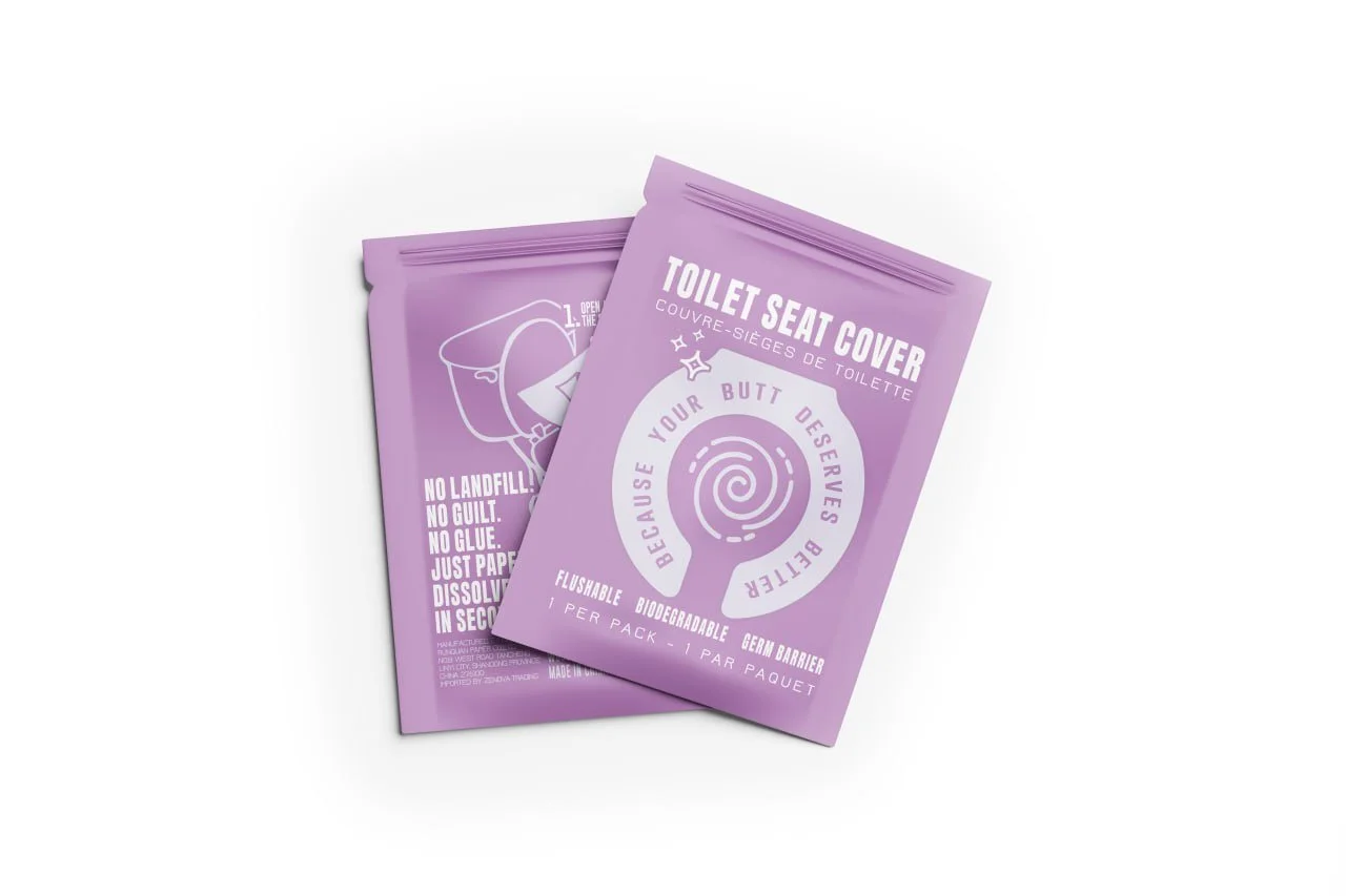 Two purple toilet seat cover packages with white text and graphics, one showing installation instructions and the other emphasizing eco-friendly features.