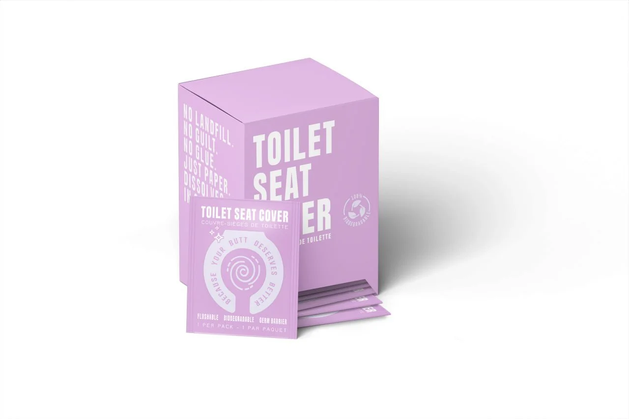 Purple toilet seat cover pack and tissue holder with text indicating eco-friendly, biodegradable, flushable, germ barrier, and designed to enhance bathroom hygiene.