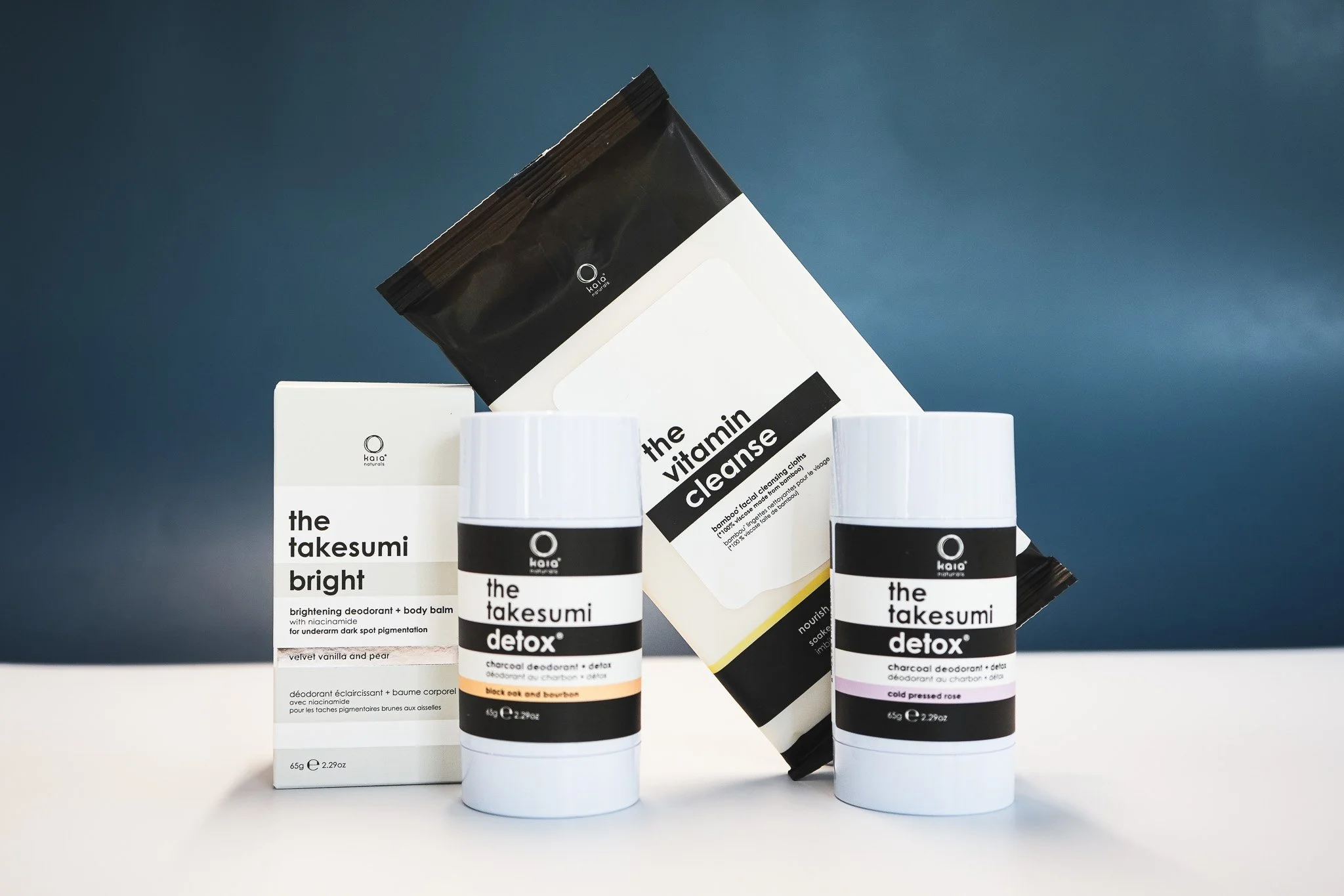  collection of skincare and deodorant products by Kaya, including detox and brightening body balm, charcoal deodorants, and cleansing cloths