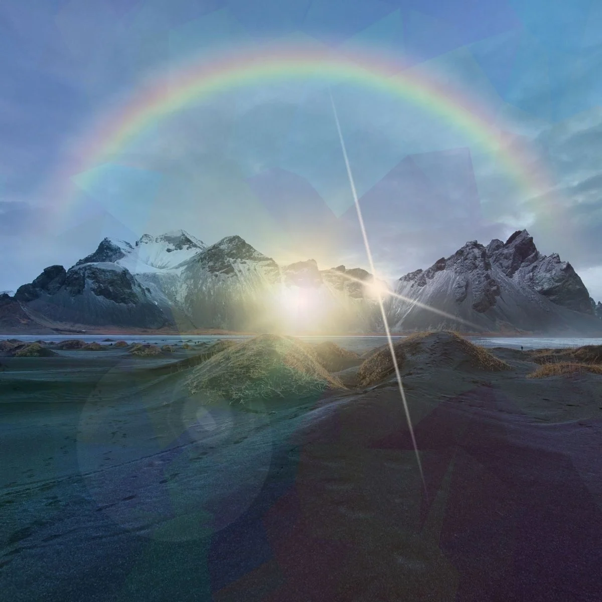 Snow-capped mountains at sunrise with a rainbow in the sky and a rainbow-colored light streak across the scene.