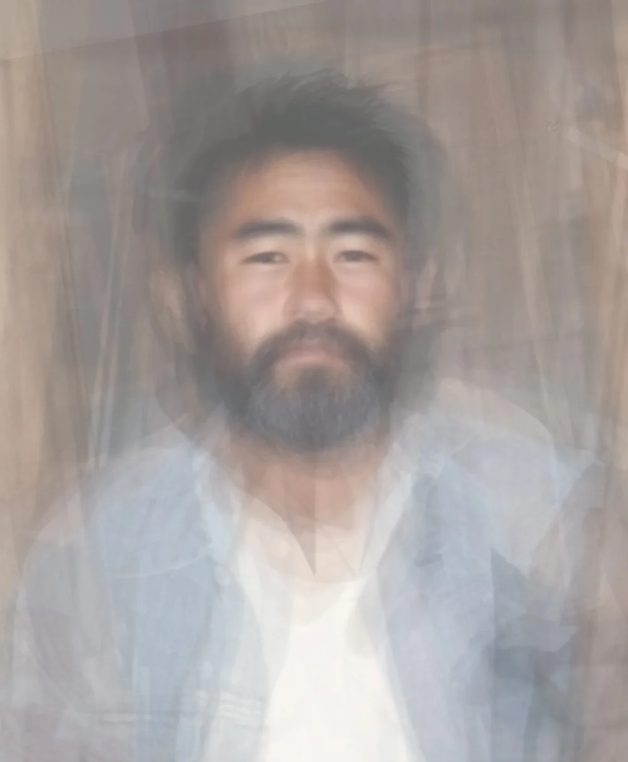   Taken in 1995 in San Jose, CA, tired Hispanic-Filipino man leaning against a doorframe and wearing a cross necklace  2025 Inkjet print 25.5 x 21” 